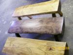 Half log benches with carved designs